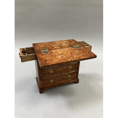 12 - An early 20th century burr walnut and satinwood veneered specimen chest, having a foldover top, twin... 