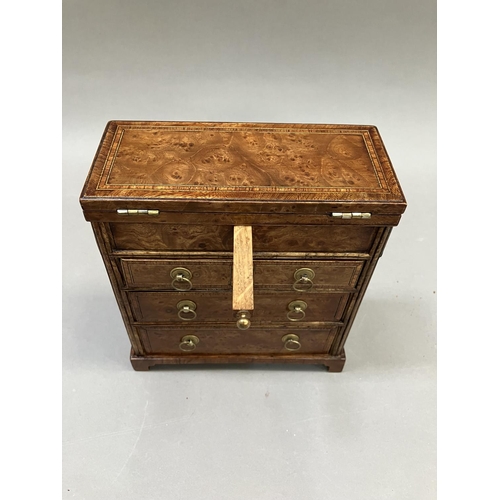 12 - An early 20th century burr walnut and satinwood veneered specimen chest, having a foldover top, twin... 