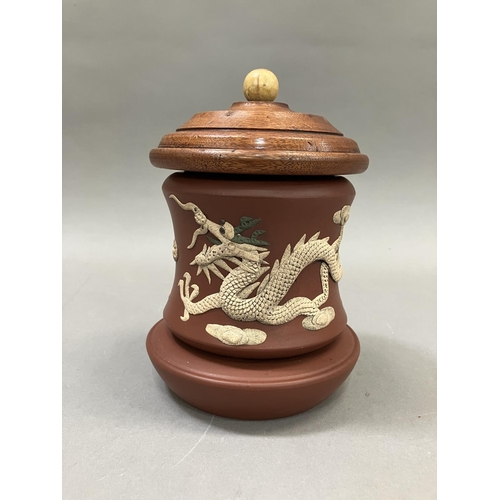 13 - A Chinese Zisha terracotta jar, the body applied with a dragon and ornamental bird having an associa... 