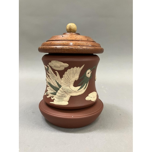 13 - A Chinese Zisha terracotta jar, the body applied with a dragon and ornamental bird having an associa... 