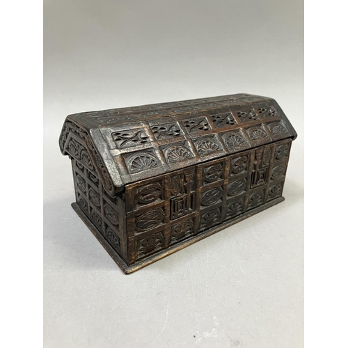 15 - An oak dome topped tea caddy, in the form of a coffer, the exterior heavily carved, stamped H. Uphil... 