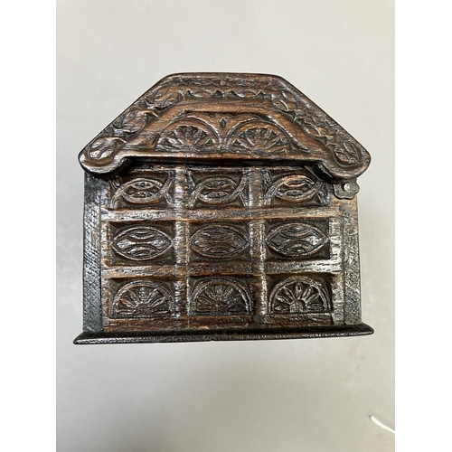 15 - An oak dome topped tea caddy, in the form of a coffer, the exterior heavily carved, stamped H. Uphil... 