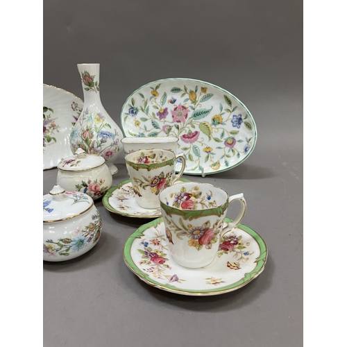 216 - A collection of ceramics painted with flowers, two gilt Minton  saucers, two 19th century cups cabin... 