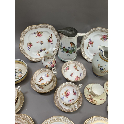 124 - An English tea service printed and enamelled with sprays of flowers including nine cups, nine saucer... 