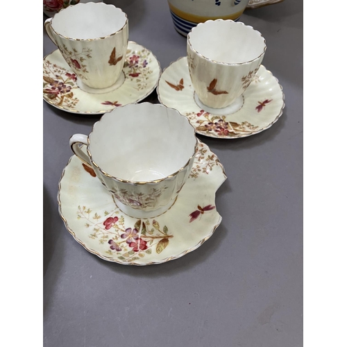 124 - An English tea service printed and enamelled with sprays of flowers including nine cups, nine saucer... 