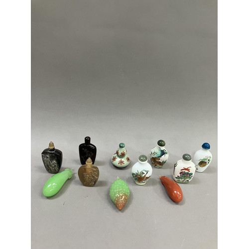 214 - A collection of eleven modern Chinese snuff bottles, in porcelain, agate etc