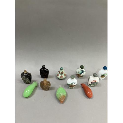 214 - A collection of eleven modern Chinese snuff bottles, in porcelain, agate etc