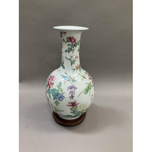 54 - A Chinese famille rose bottle neck vase, having a bulbous body and flared neck, painted with flowers... 