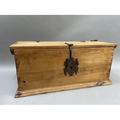 171 - A pine and metal bound trunk with lock and key, 76cm high x 35cm