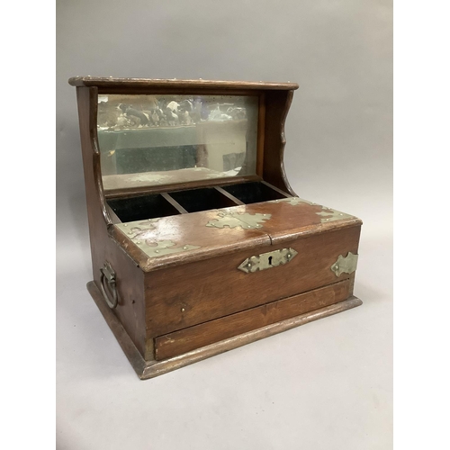 353 - An Edwardian oak plate mounted tantalus with raised mirrored back (without decanters)