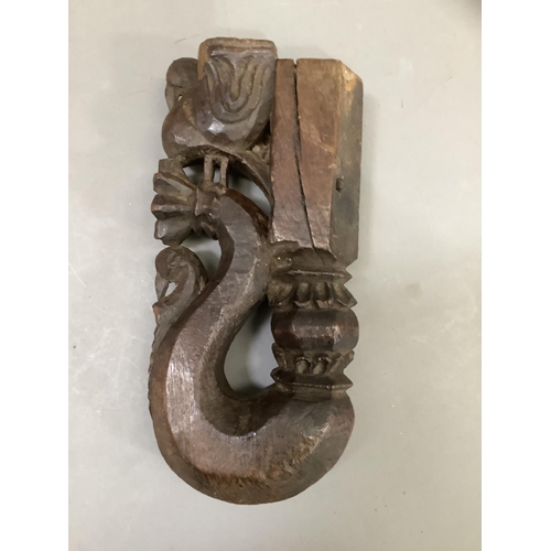 56 - A Indian carved hardwood figure of a woman, having a carved coiffure, narrow waist in ceremonial dre... 