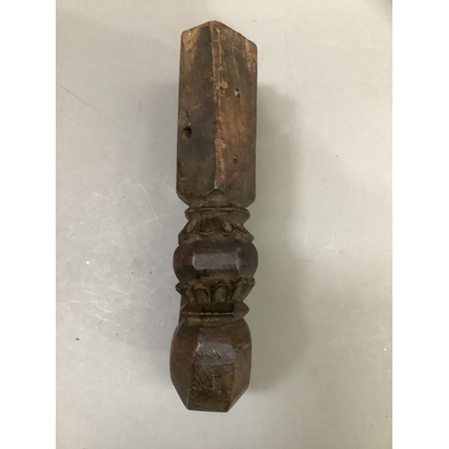 56 - A Indian carved hardwood figure of a woman, having a carved coiffure, narrow waist in ceremonial dre... 