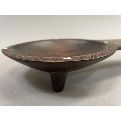 62 - Fijian ceremonial kava oil bowl, on three supports with incised geometric decoration and inset with ... 