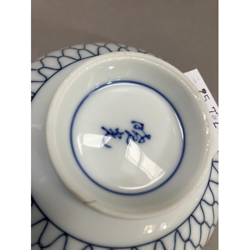 189 - A modern blue and white Chinese ware including rice bowls, saucer dishes and a metal teapot cast in ... 