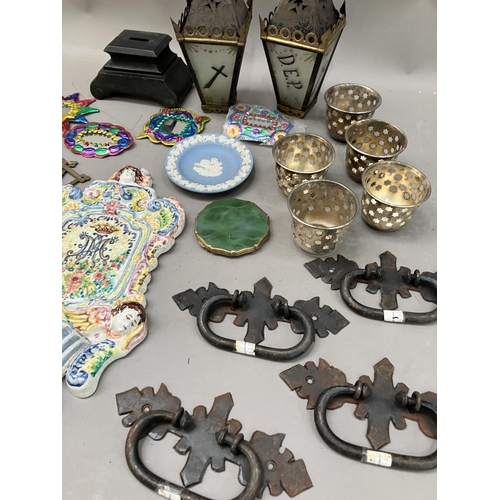 215 - Two ecclesiastical lanterns, four drawer pulls, a majolica plaque, perforated tealights, Jasperware ... 