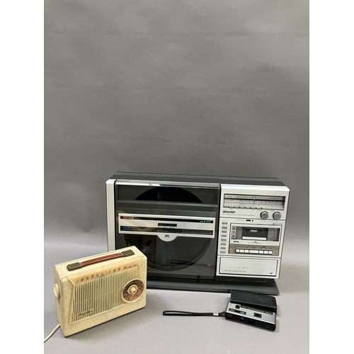 144 - A Sharp VZ-3000 Ghetto Blaster, a Pizon Bros radio and a Kodak Instamatic camera