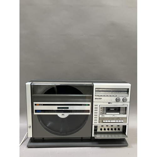 144 - A Sharp VZ-3000 Ghetto Blaster, a Pizon Bros radio and a Kodak Instamatic camera