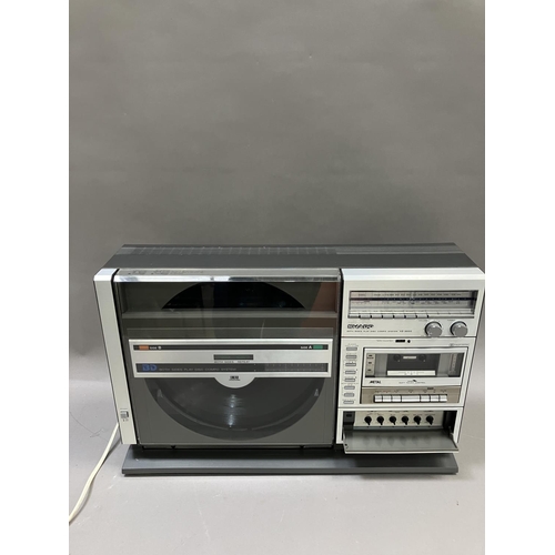 144 - A Sharp VZ-3000 Ghetto Blaster, a Pizon Bros radio and a Kodak Instamatic camera