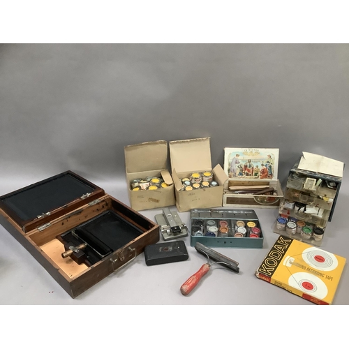 127 - An Ellams Bantam duplicator in box, a collection of enamel paints, cigar box, Kodak reel, film splic... 