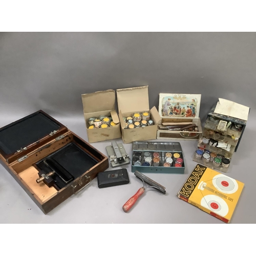 127 - An Ellams Bantam duplicator in box, a collection of enamel paints, cigar box, Kodak reel, film splic... 