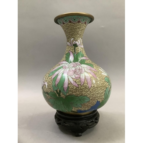 70 - A Chinese cloisonne vase of bottle form with narrow neck and flared rim, the body decorated with pin... 