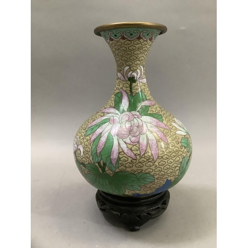 70 - A Chinese cloisonne vase of bottle form with narrow neck and flared rim, the body decorated with pin... 