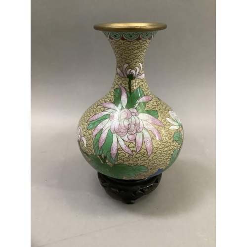 70 - A Chinese cloisonne vase of bottle form with narrow neck and flared rim, the body decorated with pin... 