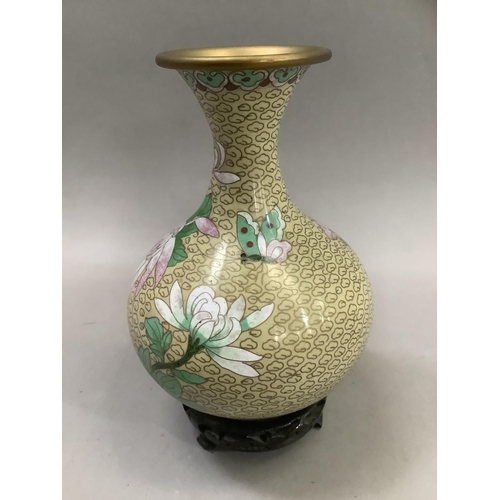 70 - A Chinese cloisonne vase of bottle form with narrow neck and flared rim, the body decorated with pin... 