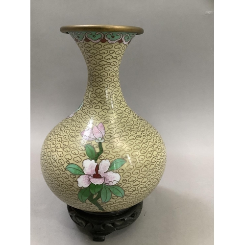 70 - A Chinese cloisonne vase of bottle form with narrow neck and flared rim, the body decorated with pin... 