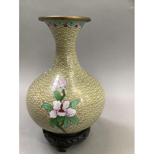 70 - A Chinese cloisonne vase of bottle form with narrow neck and flared rim, the body decorated with pin... 