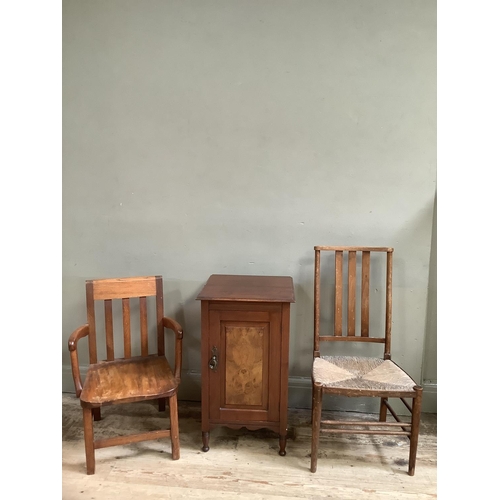 134 - A walnut pot cupboard with single door, a child's oak armchair and a rush seated bedroom chair in el... 