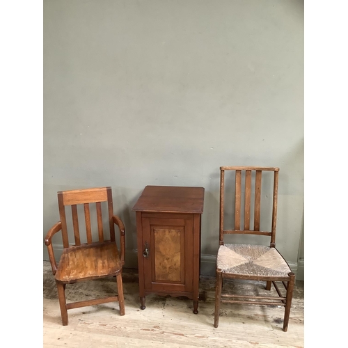 134 - A walnut pot cupboard with single door, a child's oak armchair and a rush seated bedroom chair in el... 