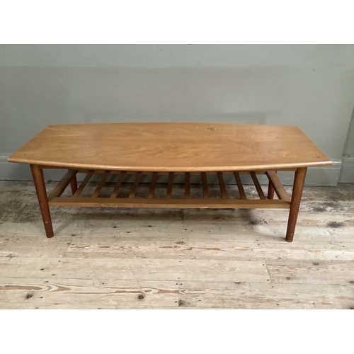 140 - A mid century teak coffee table with rack under tier, 120cm x 54cm