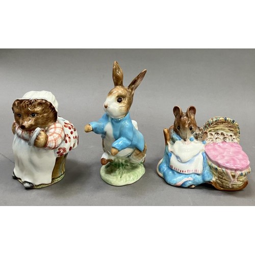 28 - Three Beswick Beatrix Potter figures, 'Mrs Tiggy Winkle', 'Hunca Munca' and Peter Rabbit, all with g... 