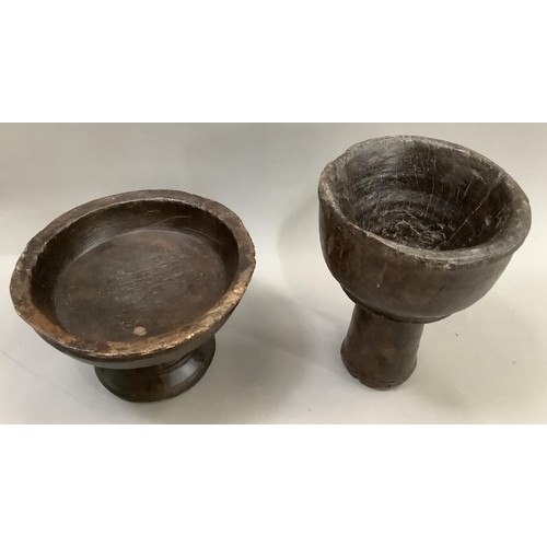 58 - A primitive pedestal bowl having turned rim and incised decoration 14cm high together with an associ... 