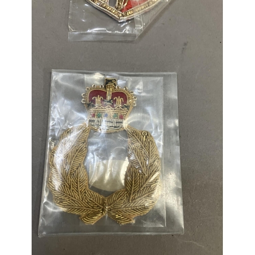 260 - A collection of embroidered uniform insignias