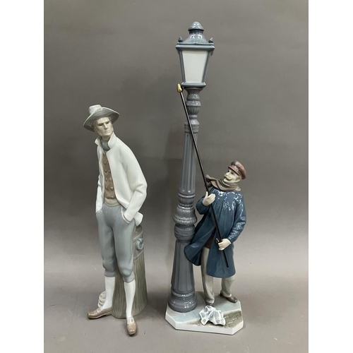 75 - A Lladro figure of a Lamplighter, no.5205 48cm high and a figure of a Sailor no.4657