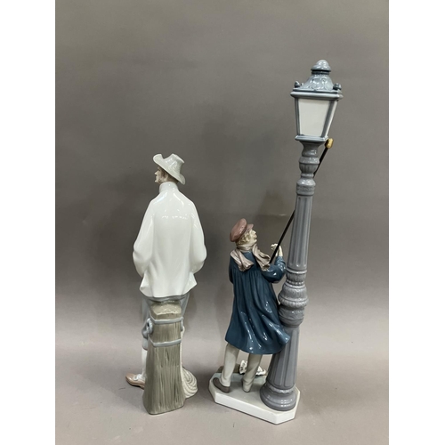 75 - A Lladro figure of a Lamplighter, no.5205 48cm high and a figure of a Sailor no.4657