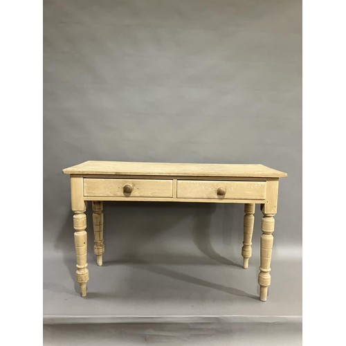 167 - A stripped pine kitchen table having two drawers on turned legs 120cm wide x 49cm deep x 76cm high