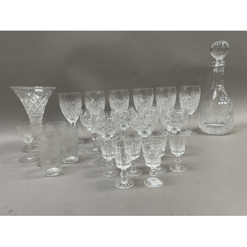 198 - A collection of cut glass comprising a suite of wines, a suite of brandy glasses, and a suite of six... 