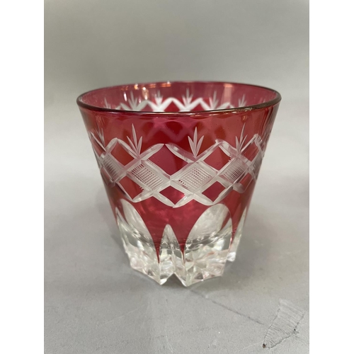 79 - A suite of six Bohemian cut glass cranberry tumblers