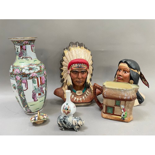 186 - Two ceramic figures of a Native American couple with headdresses , a Famille rose vase, a Royal Doul... 