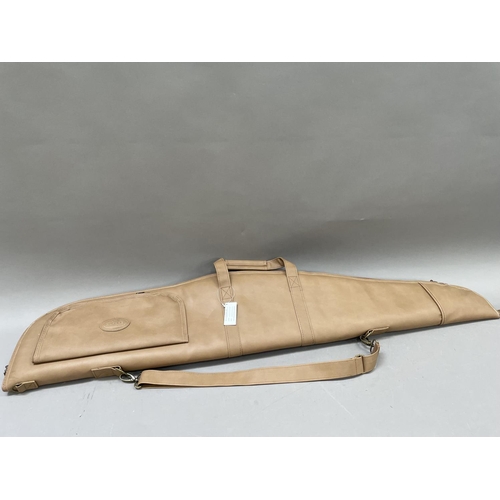 312 - A shotgun slip by Klever Sport in tan leather effect with black padded interior, suitable for an ove... 