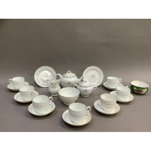 192 - A Victorian dolls tea service, with gilt detailing on white, the teapot, sugar bowl and milk jug hav... 