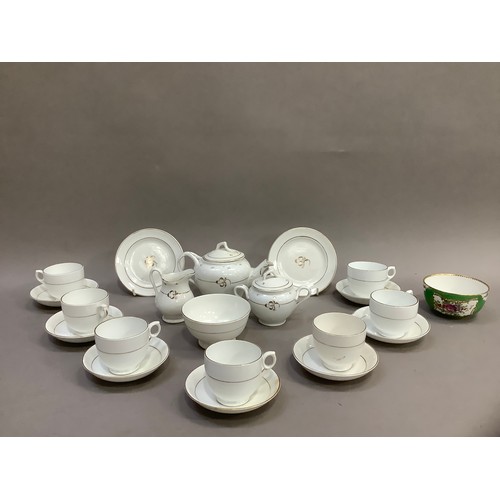 192 - A Victorian dolls tea service, with gilt detailing on white, the teapot, sugar bowl and milk jug hav... 