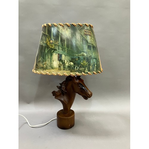 91 - A lamp modelled as a composite horses head on round plinth base, 50cm high