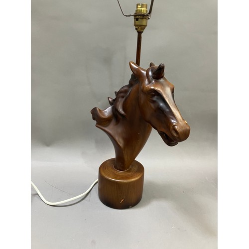 91 - A lamp modelled as a composite horses head on round plinth base, 50cm high