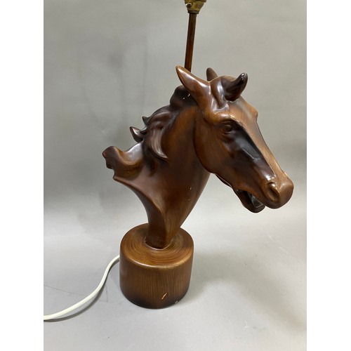 91 - A lamp modelled as a composite horses head on round plinth base, 50cm high