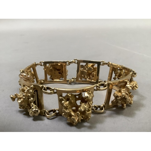 293 - A "nugget" bracelet circa 1970 (tests as 18ct gold), approx. weight 65g