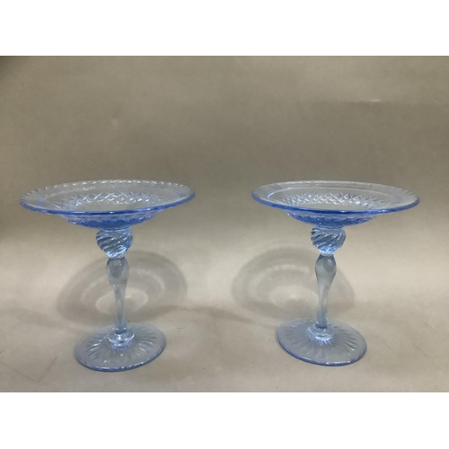 97 - A pair of pale blue cut glass sweetmeat pedestal dishes with moulded stems, 16cm high